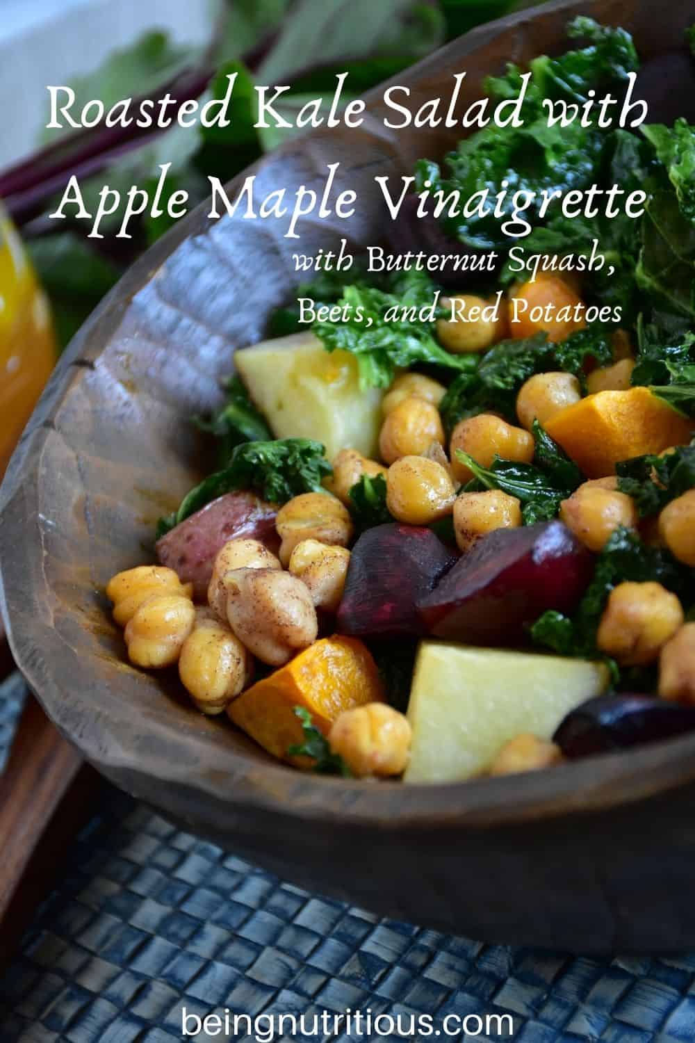 Kale salad in a wooden bowl. Text overlay: Roasted Kale Salad with Apple Maple Vinaigrette, with butternut squash, beets, and red potatoes.