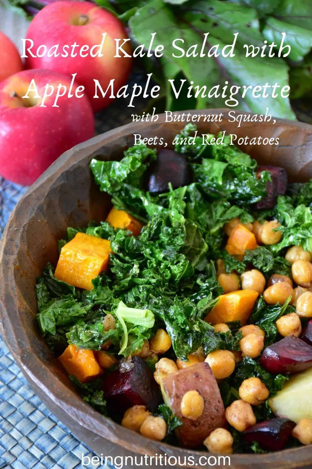 Kale salad in a wooden bowl. Text overlay: Roasted Kale Salad with Apple Maple Vinaigrette, with butternut squash, beets, and red potatoes.