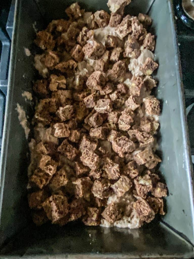Bread cubes on top of nice cream.