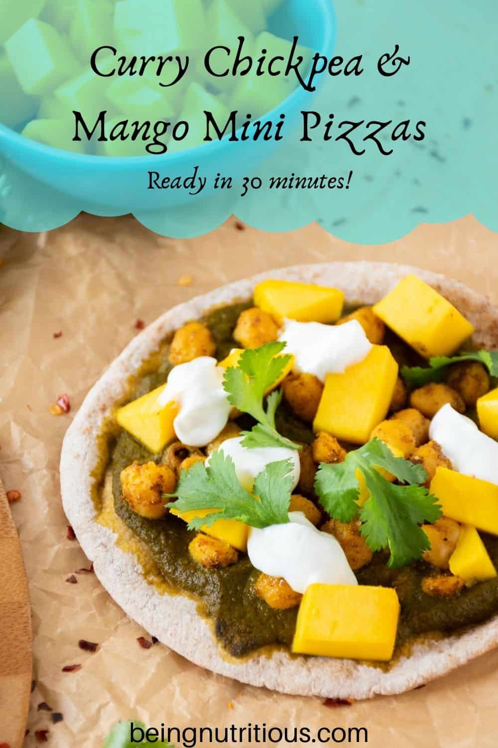 pizza with spinach sauce, chickpeas, and mangoes on a mini pita. Text overlay: Curry Chickpea & mango mini pizzas; ready in 30 minutes!
