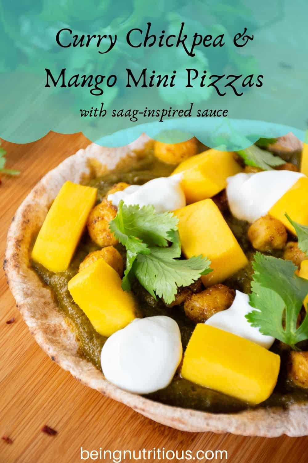 pizza with spinach sauce, chickpeas, and mangoes on a mini pita. Text overlay: Curry Chickpea & mango mini pizzas; with saag-inspired sauce.