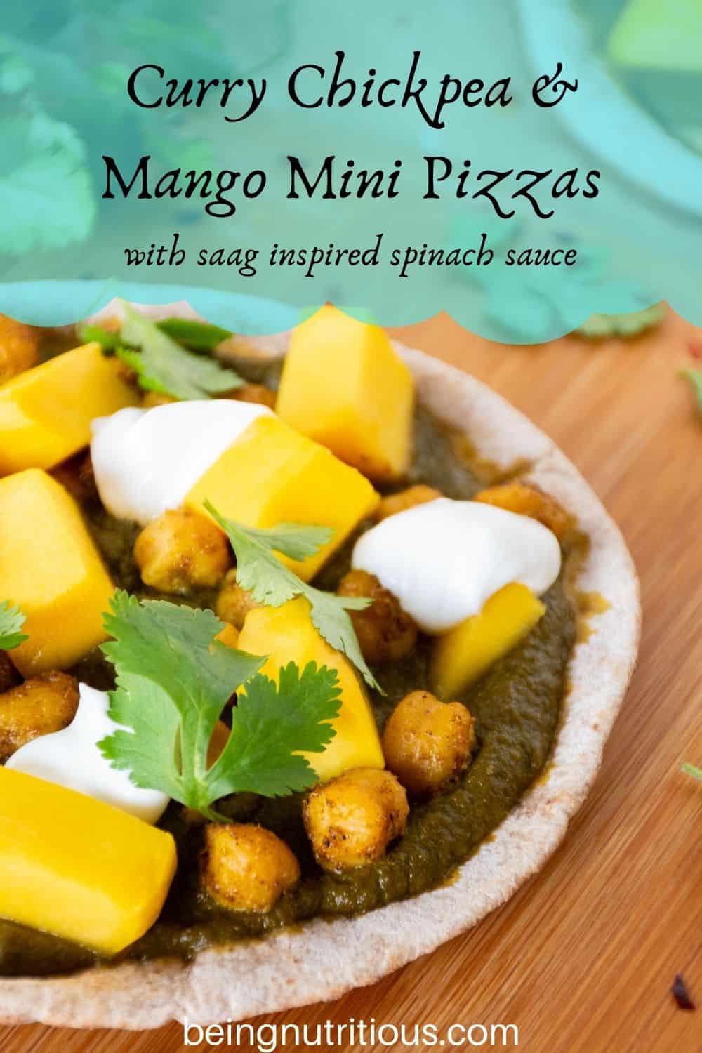 pizza with spinach sauce, chickpeas, and mangoes on a mini pita. Text overlay: Curry Chickpea & mango mini pizzas; with saag inspired spinach sauce.