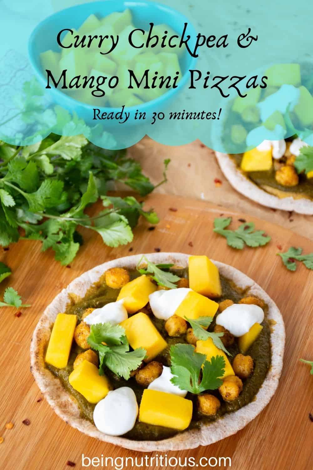 pizza with spinach sauce, chickpeas, and mangoes on a mini pita. Text overlay: Curry Chickpea & mango mini pizzas; ready in 30 minutes!