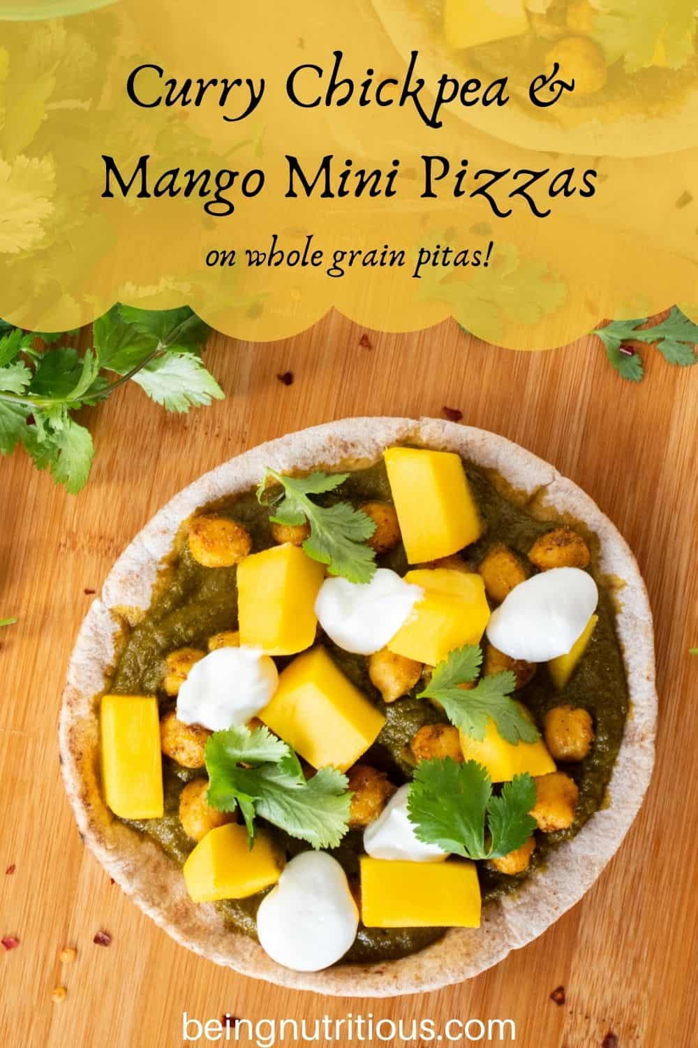 pizza with spinach sauce, chickpeas, and mangoes on a mini pita. Text overlay: Curry Chickpea & mango mini pizzas; on whole grain pitas!