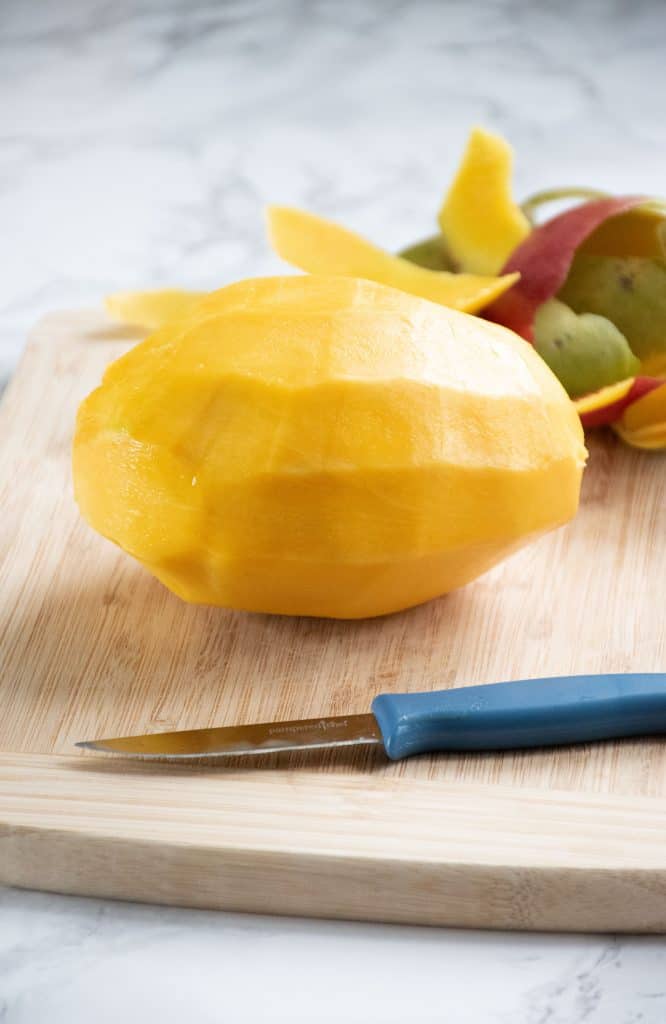 Whole mango with skin removed.