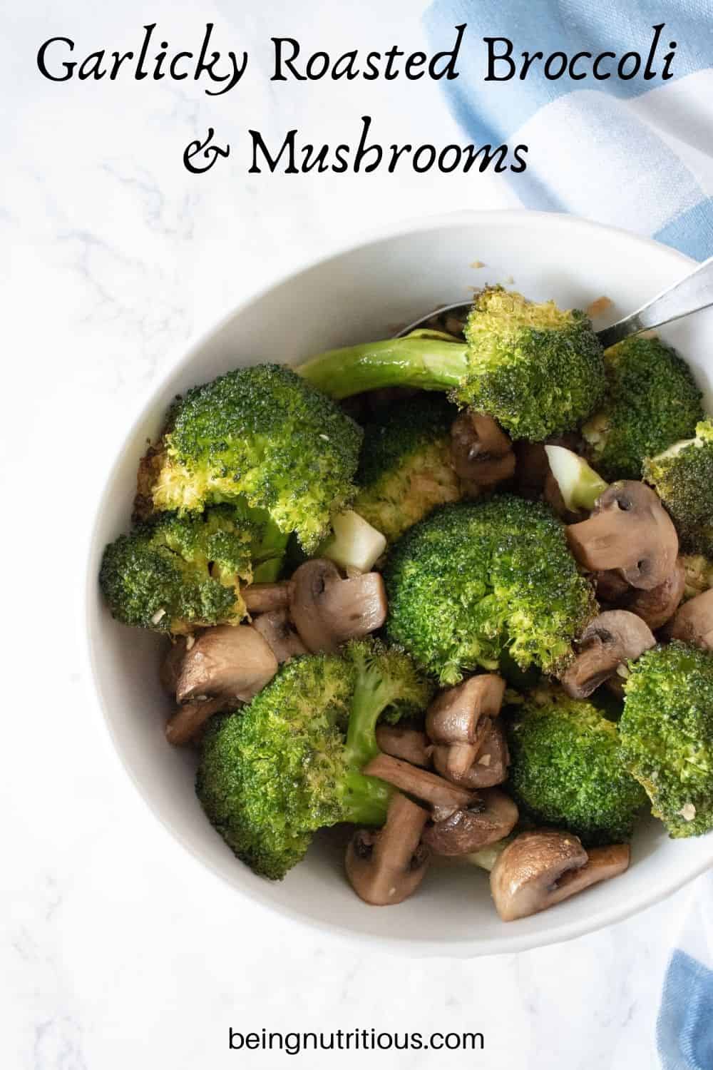 Roasted broccoli and mushrooms in a bowl. Text overlay: Garlicky Roasted Broccoli and Mushrooms.