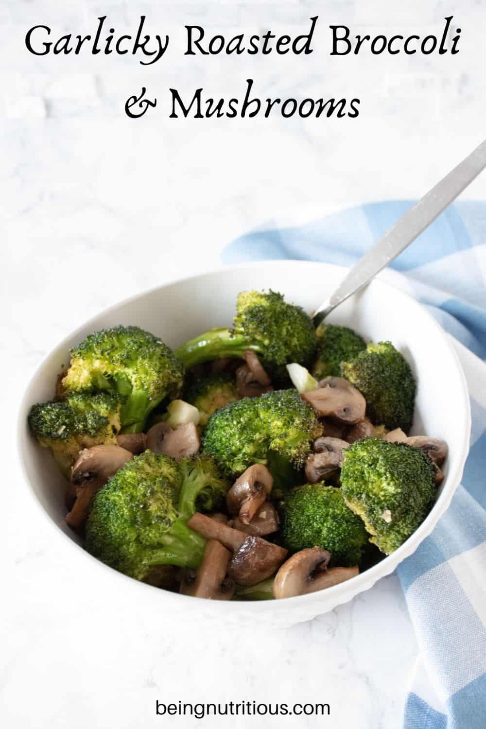 Roasted broccoli and mushrooms in a bowl. Text overlay: Garlicky Roasted Broccoli and Mushrooms.