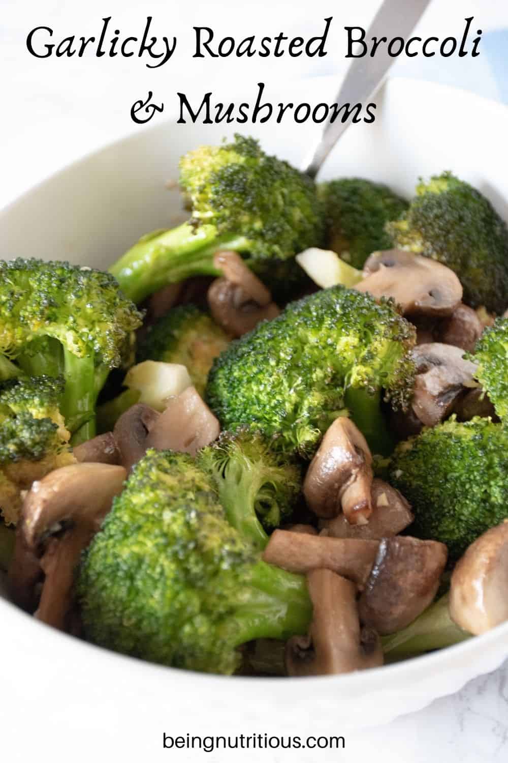 Roasted broccoli and mushrooms in a bowl. Text overlay: Garlicky Roasted Broccoli and Mushrooms.