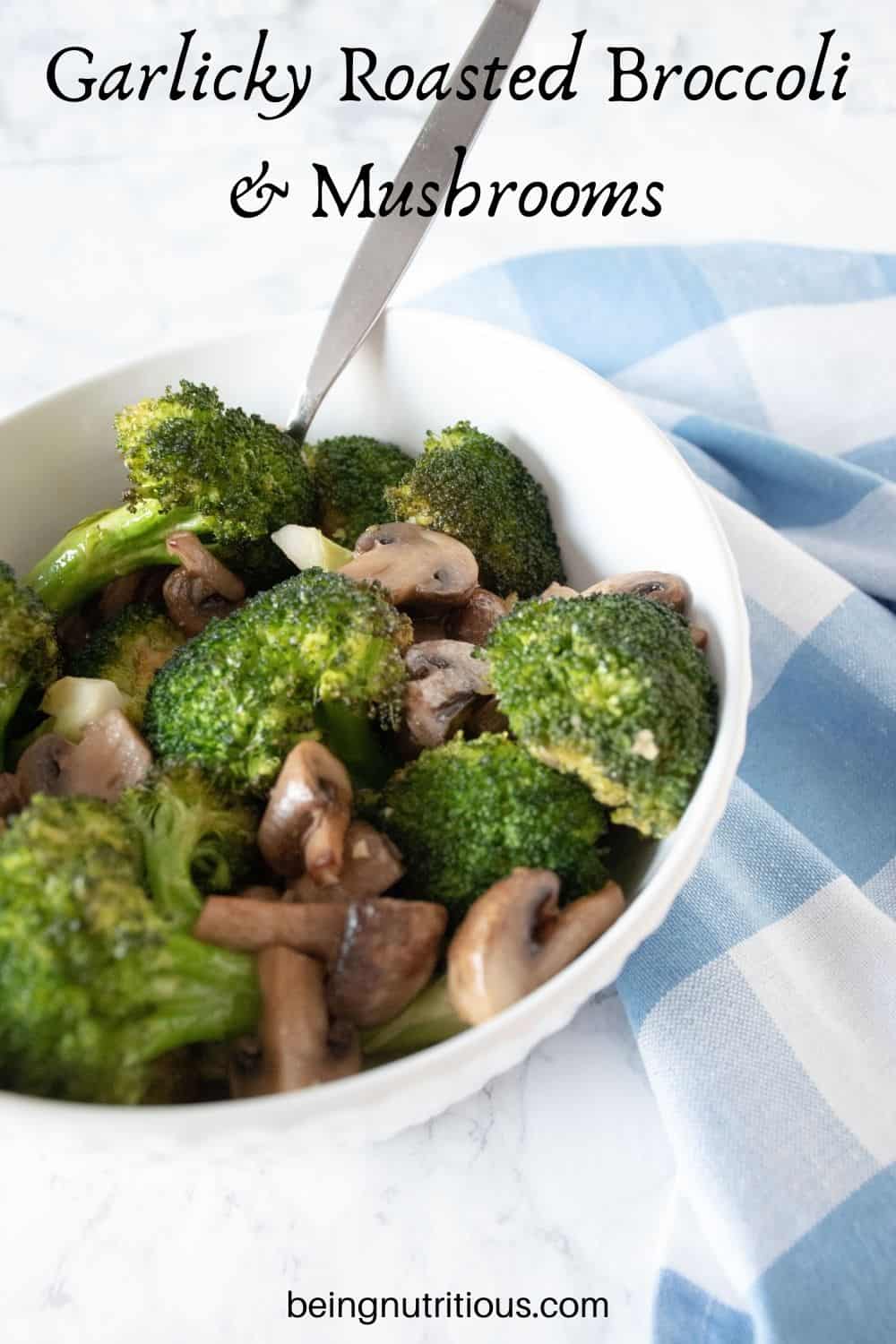 Roasted broccoli and mushrooms in a bowl. Text overlay: Garlicky Roasted Broccoli and Mushrooms.