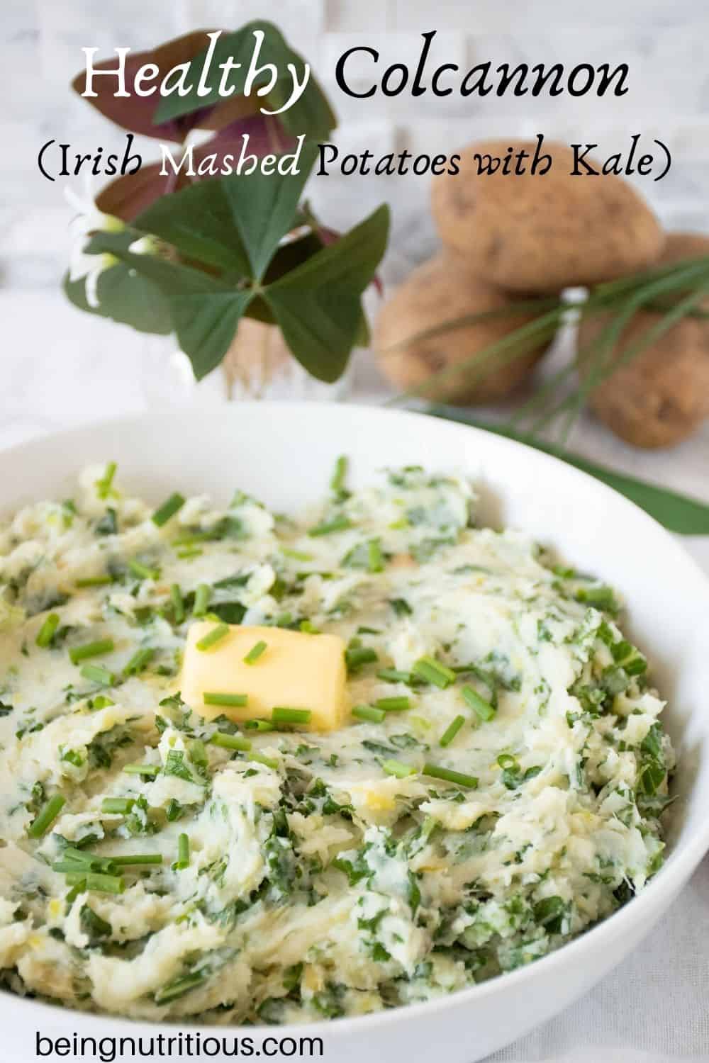 Bowl of mashed potatoes with a pat of butter on top. Text overlay: Healthy Colcannon (Irish mashed potatoes with kale).