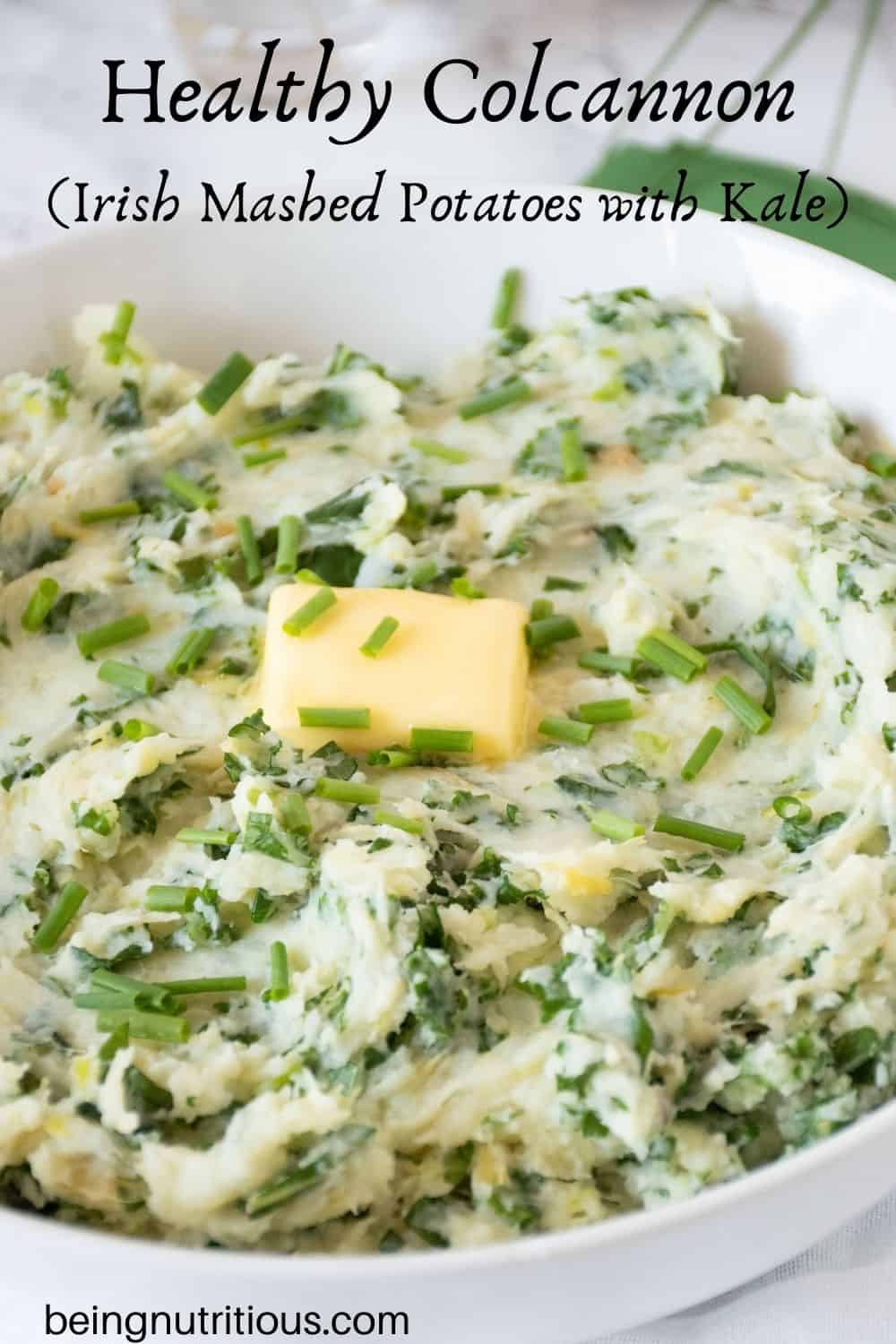 Bowl of mashed potatoes with a pat of butter on top. Text overlay: Healthy Colcannon (Irish mashed potatoes with kale).