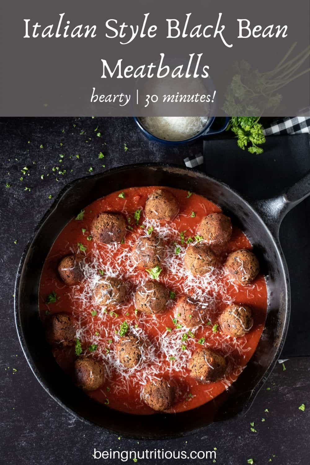 Skillet with meatballs made of black beans with marinara sauce. Text overlay: Italian Style Black Bean Meatballs; hearty, 30 minutes!
