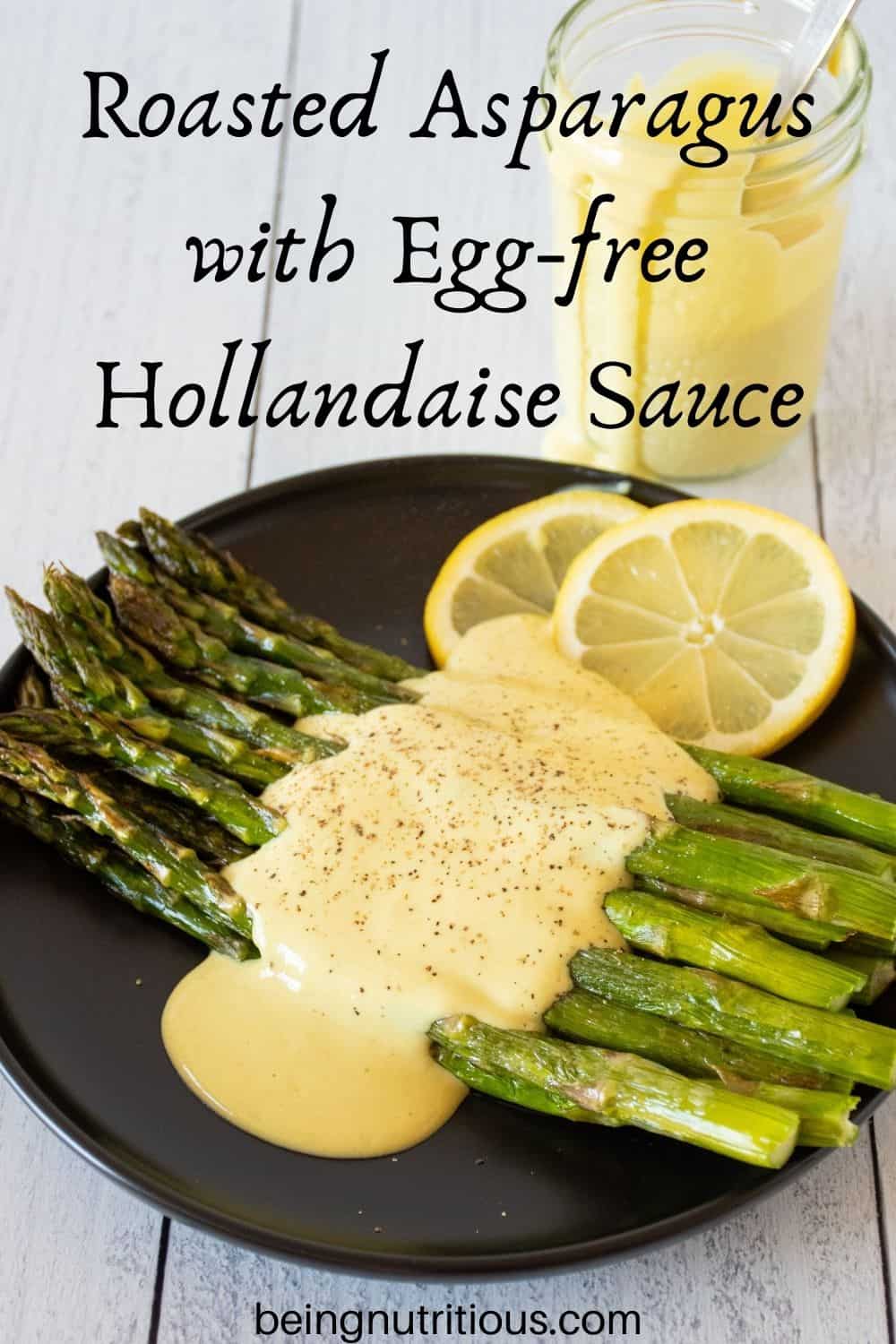 Plate of asparagus drizzled with sauce. Text overlay: Roasted Asparagus with Egg free Hollandaise Sauce.