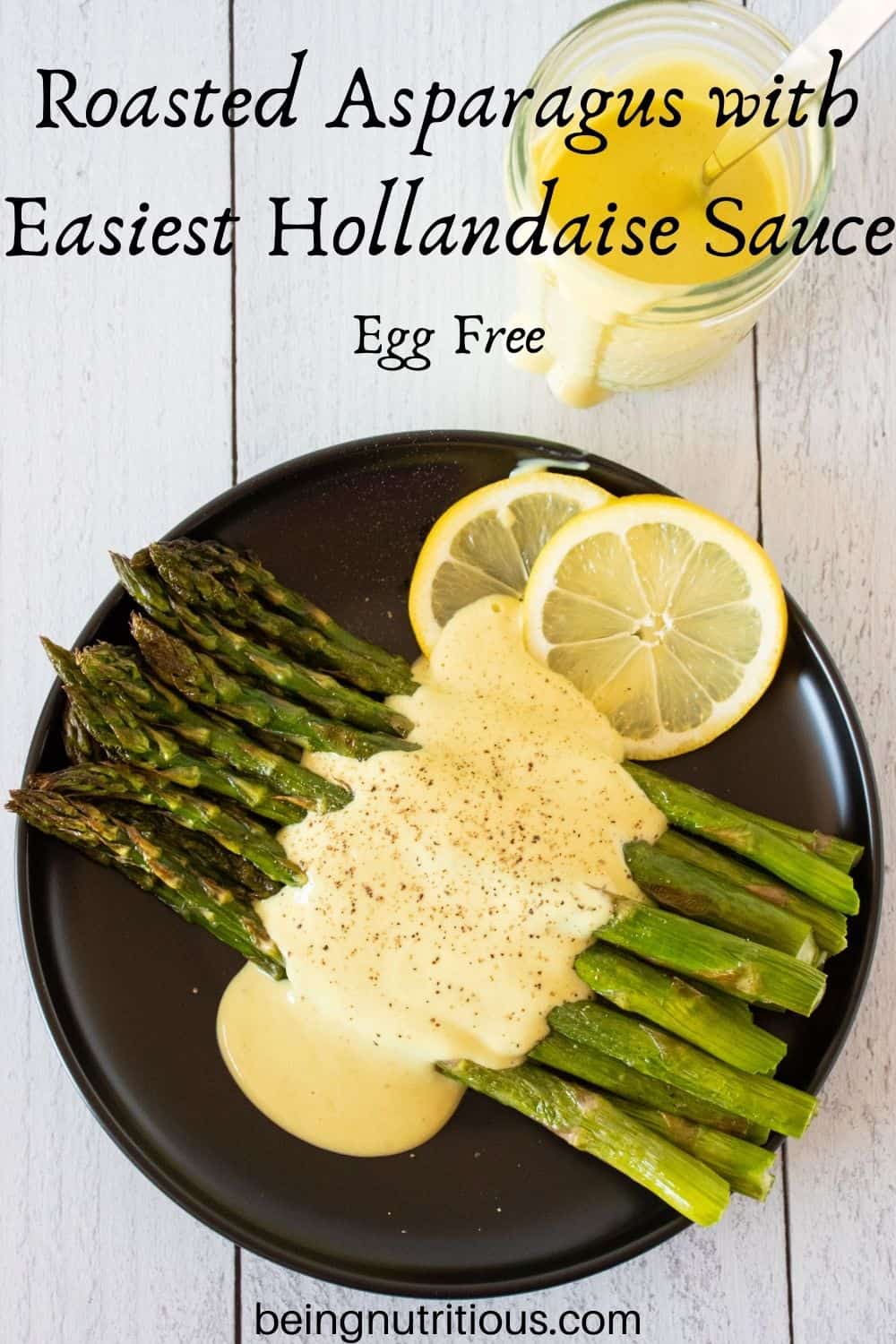 Plate of asparagus drizzled with sauce. Text overlay: Roasted Asparagus with Easiest Hollandaise Sauce; Egg Free