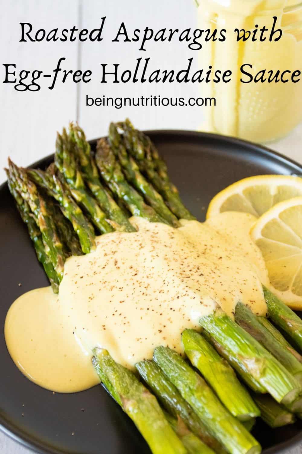 Plate of asparagus drizzled with sauce. Text overlay: Roasted Asparagus with Egg free Hollandaise Sauce.