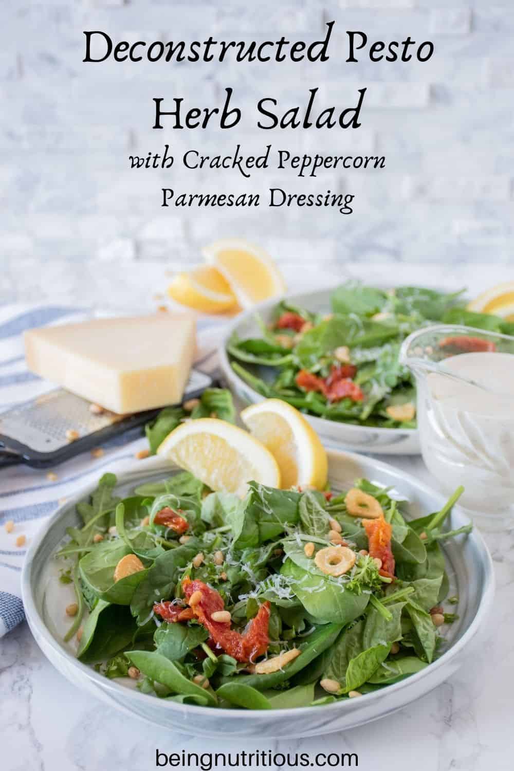 Plates of salad with sundried tomatoes, and fried garlic. Text overlay: Deconstructed Pesto Herb Salad with Cracked Peppercorn Parmesan Dressing
