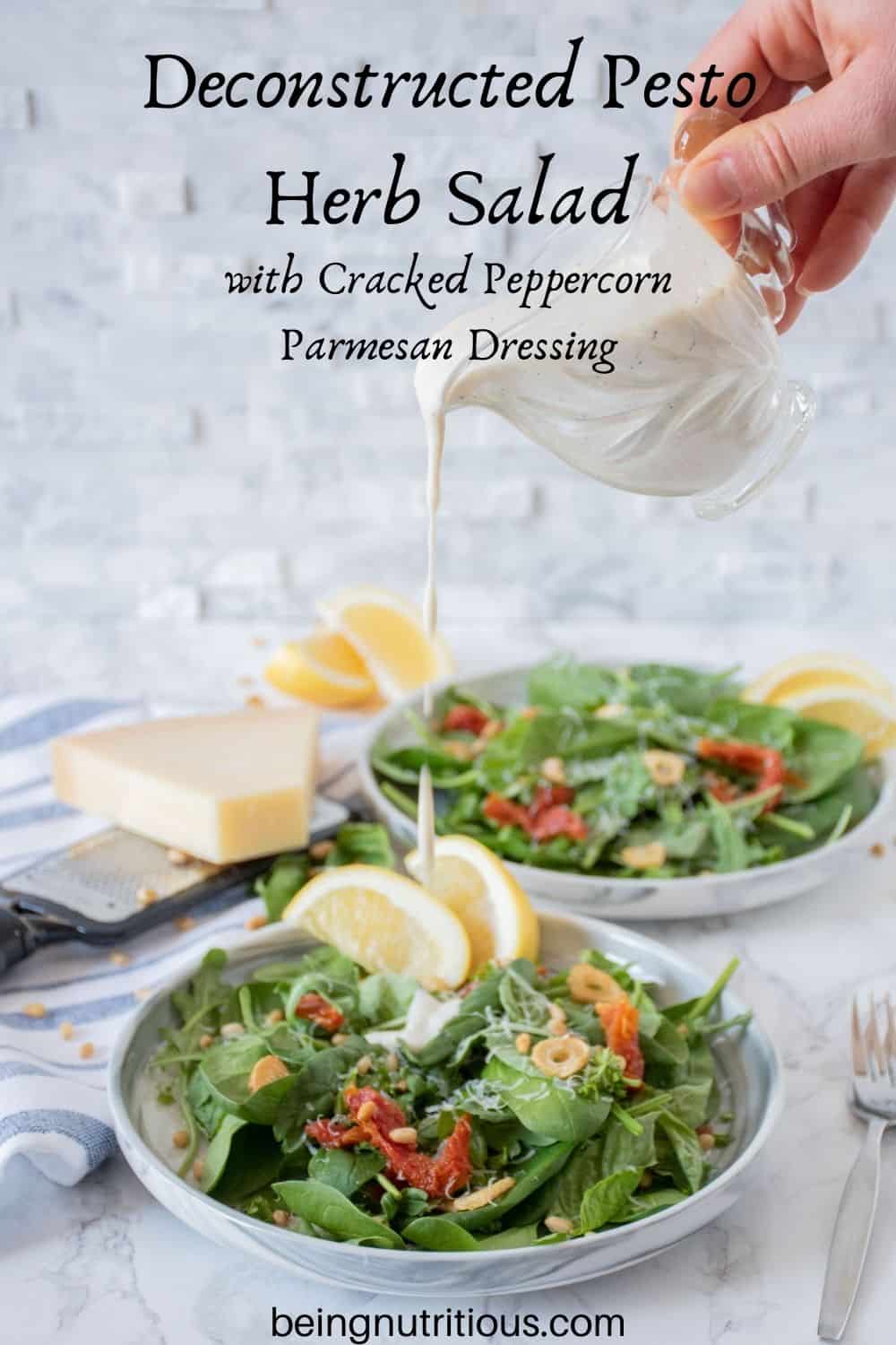 Plate of salad with sundried tomatoes, and fried garlic with dressing being drizzled over. Text overlay: Deconstructed Pesto Herb Salad with Cracked Peppercorn Parmesan Dressing
