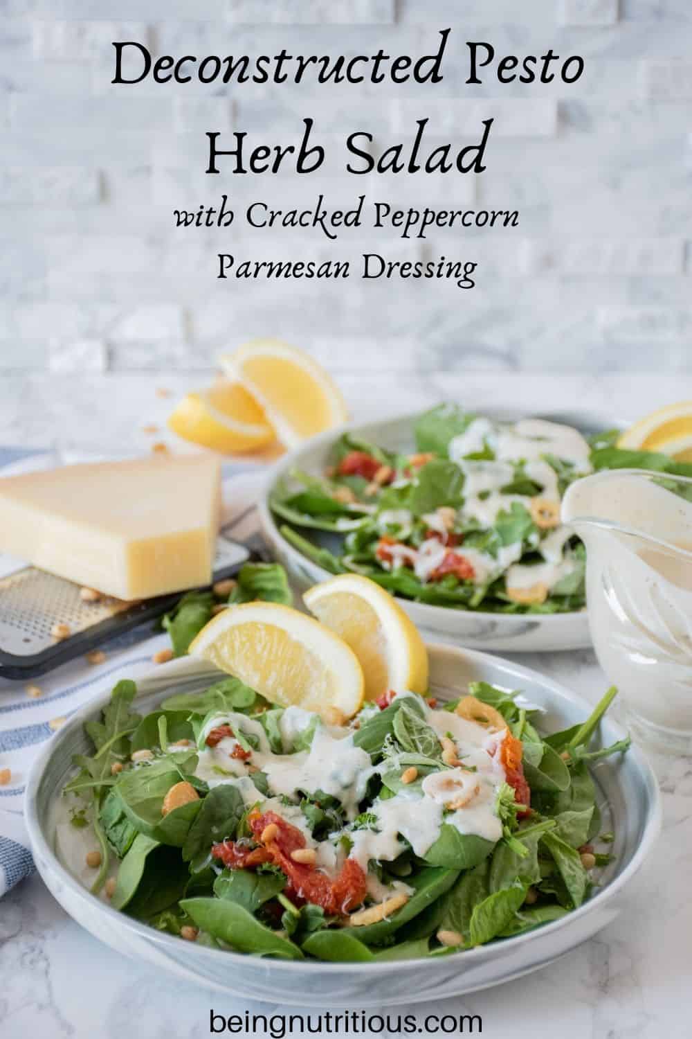 Plate of salad with sundried tomatoes, and fried garlic with dressing. Text overlay: Deconstructed Pesto Herb Salad with Cracked Peppercorn Parmesan Dressing