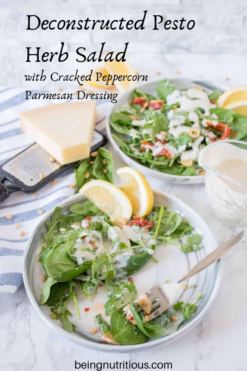Plate of half eaten salad with sundried tomatoes, and fried garlic with dressing. Text overlay: Deconstructed Pesto Herb Salad with Cracked Peppercorn Parmesan Dressing