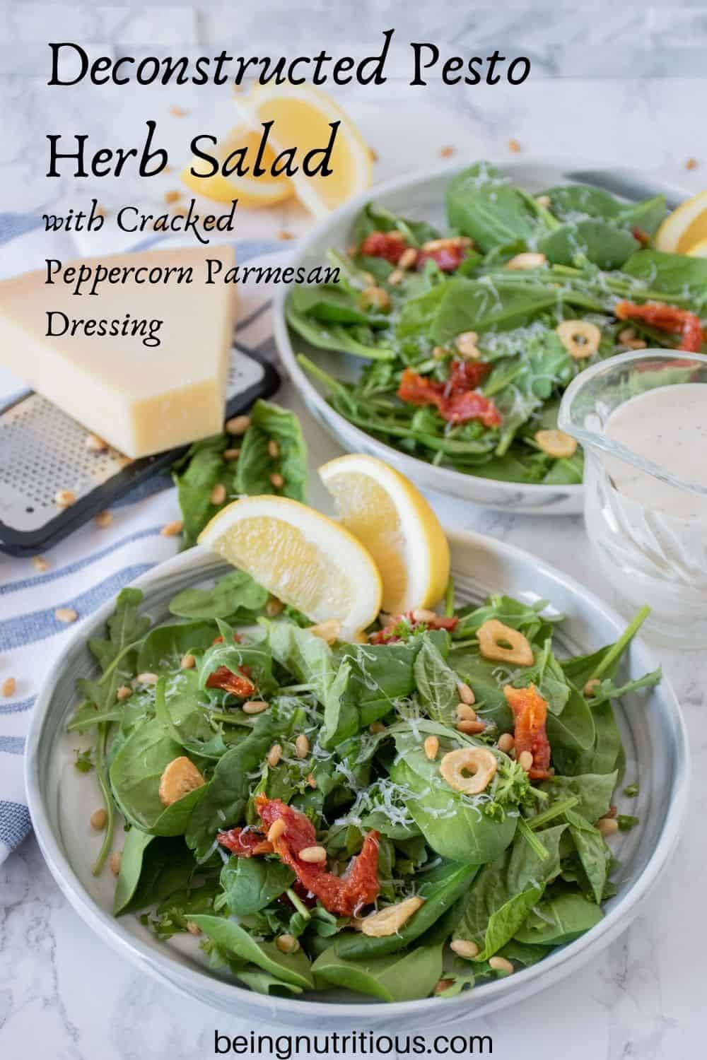 Plates of salad with sundried tomatoes, and fried garlic. Text overlay: Deconstructed Pesto Herb Salad with Cracked Peppercorn Parmesan Dressing