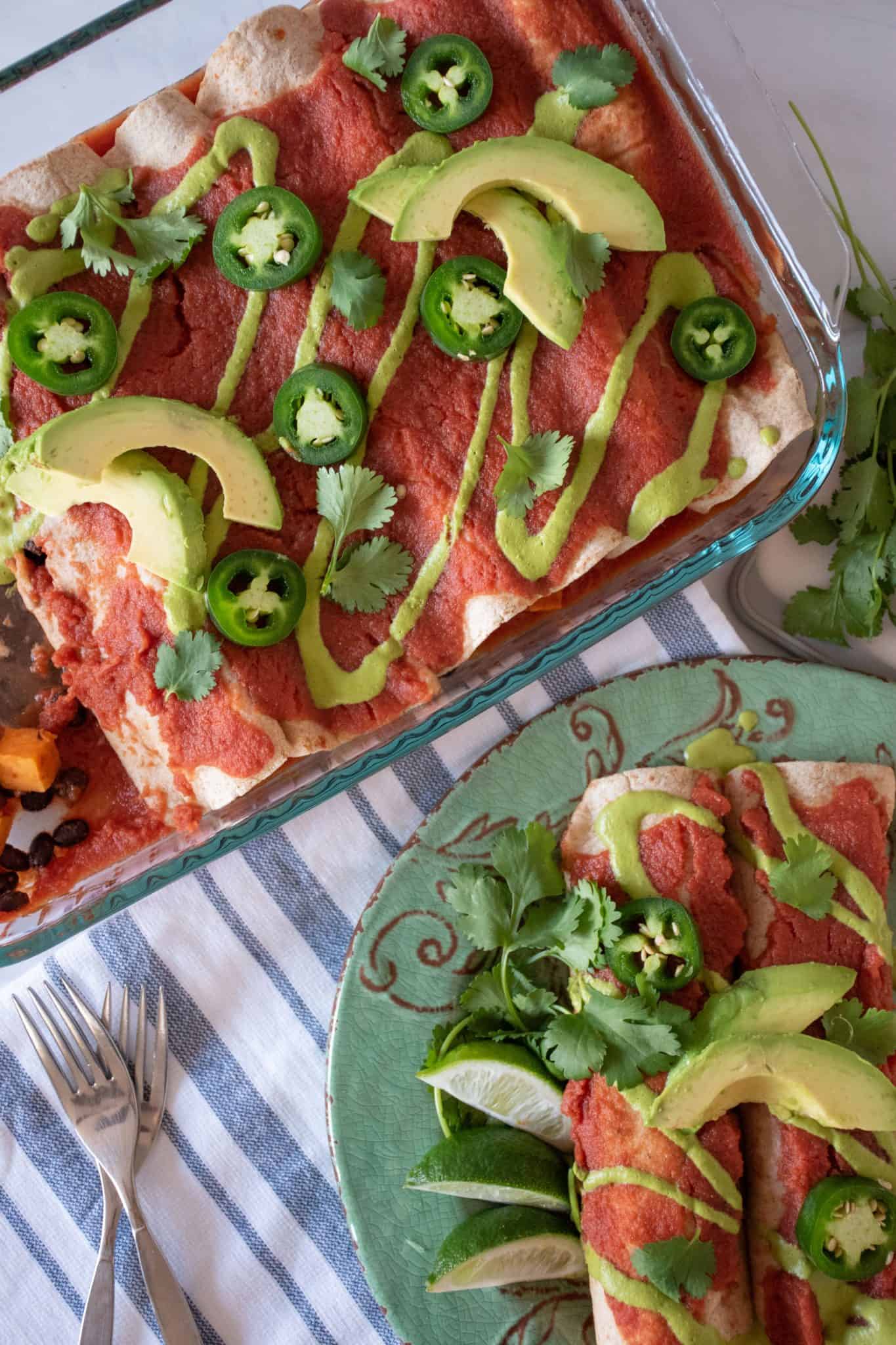 Overhead shot of enchiladas on a plate and pan of enchiladas.