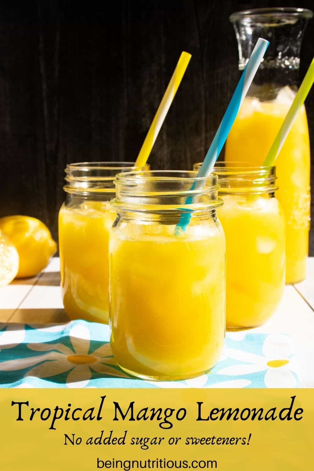 Three Mason jars with lemonade in them. Text overlay: Tropical Mango Lemonade; No added sugar or sweeteners!