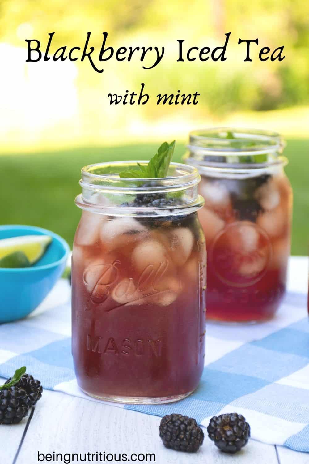 Iced tea in Mason jars, with ice, blackberries, and mint. Text overlay: Blackberry Iced Tea with mint.