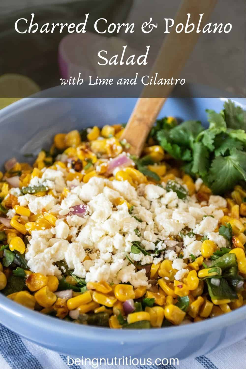 Corn salad in a bowl. Text overlay: Charred Corn & Poblano Salad with Lime and Cilantro.