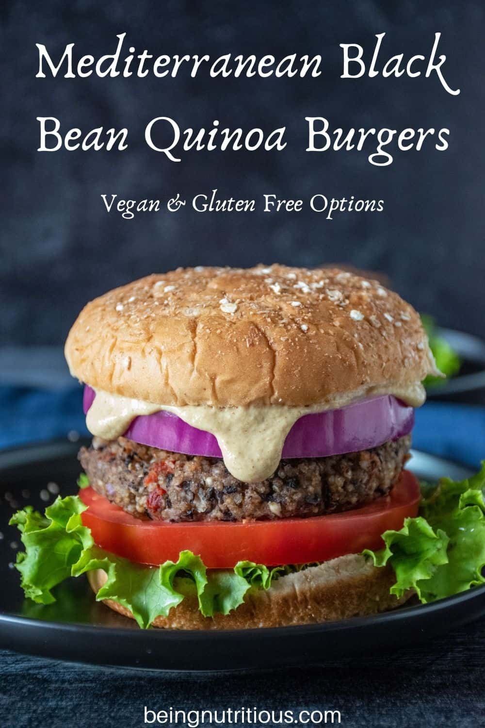 Bean burger on a bun, with onions, tomatoes, lettuce and sauce dripping out. Text overlay: Mediterranean Black Bean Quinoa Burgers; Vegan & Gluten Free Options.