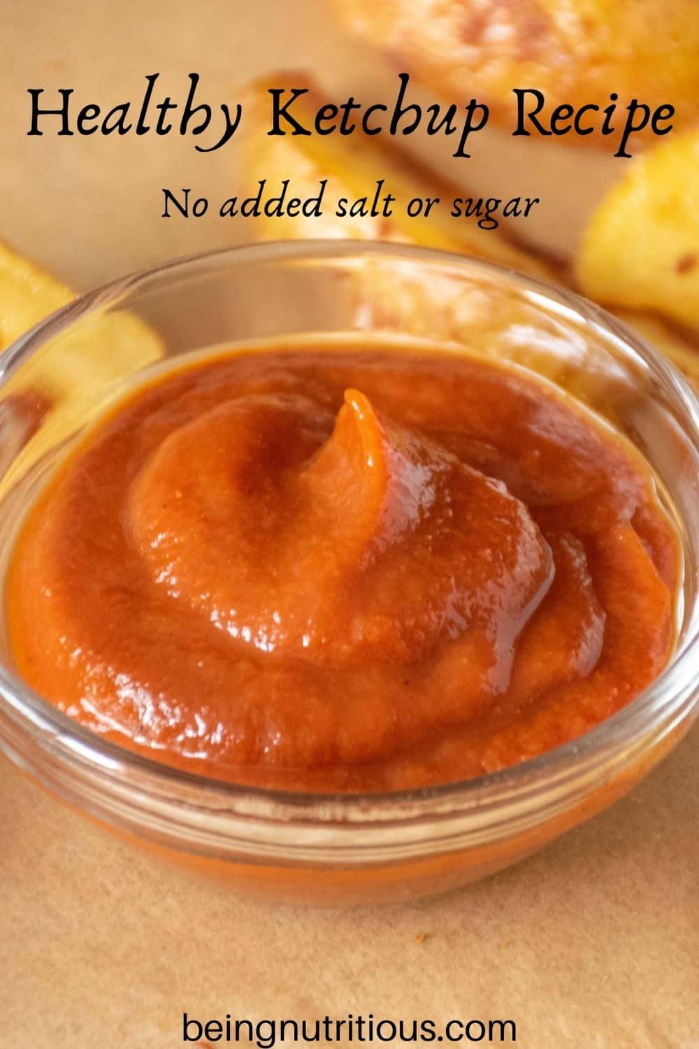 Close up of small glass dish of ketchup. Text overlay: Healthy Ketchup Recipe; no added salt or sugar.