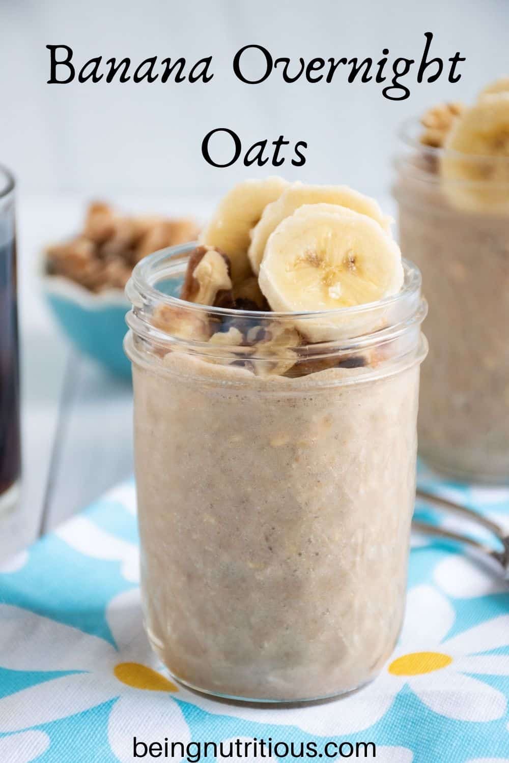 Small mason jar of oatmeal with walnuts and banana slices on top. Text overlay: Banana Overnight Oats.