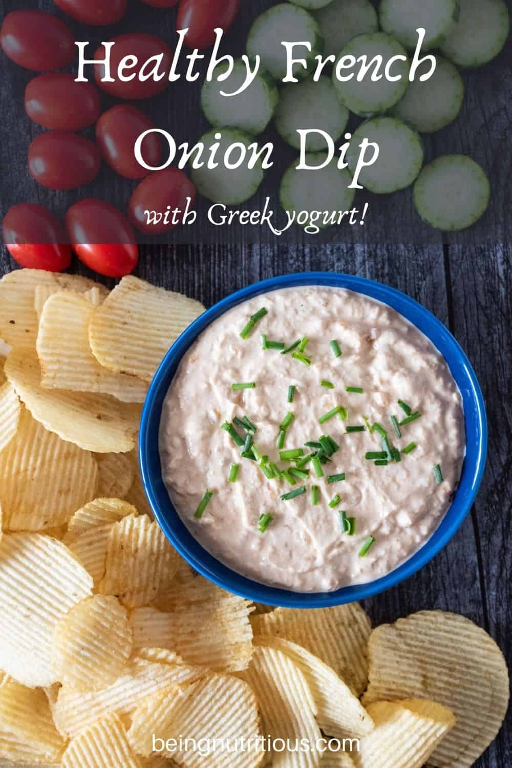 Overhead picture of bowl of dip, surrounded by chips, baby tomatoes, and cucumber slices. Text overlay: Healthy French Onion Dip, with Greek yogurt!