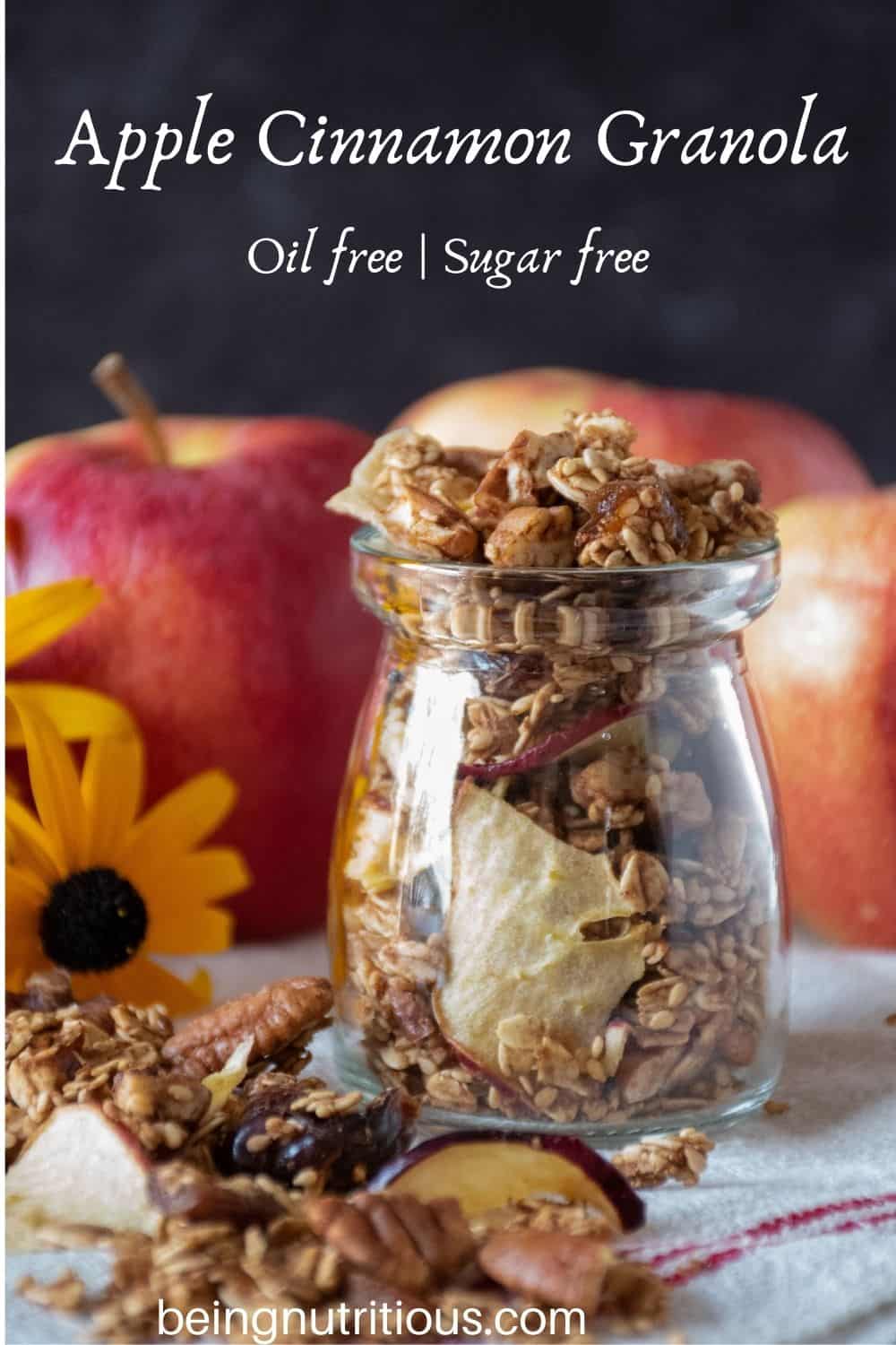 Small jar with granola in it. Text overlay: Apple Cinnamon Granola; oil free, sugar free.