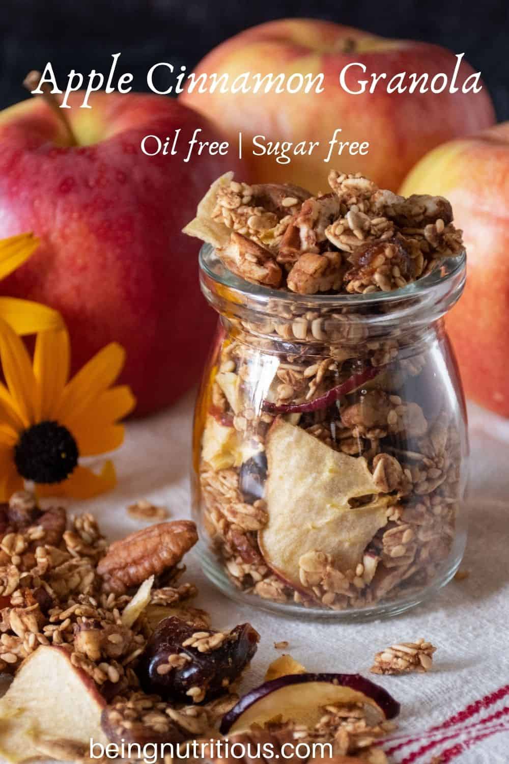 Small jar with granola in it. Text overlay: Apple Cinnamon Granola; oil free, sugar free.