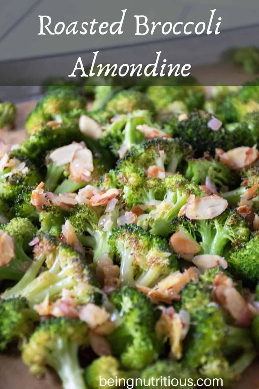 Sheet pan of roasted broccoli with almond topping. Text overlay: Roasted Broccoli Almondine.