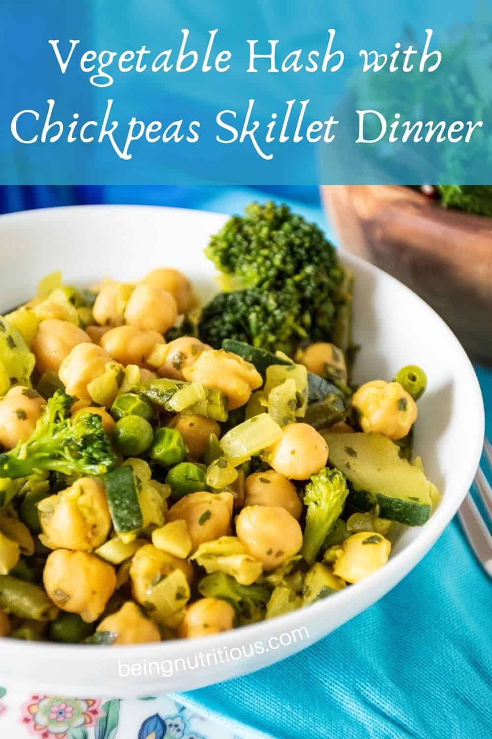 Close up of vegetable hash in a bowl. Text overlay: Vegetable Hash with Chickpeas Skillet Dinner.