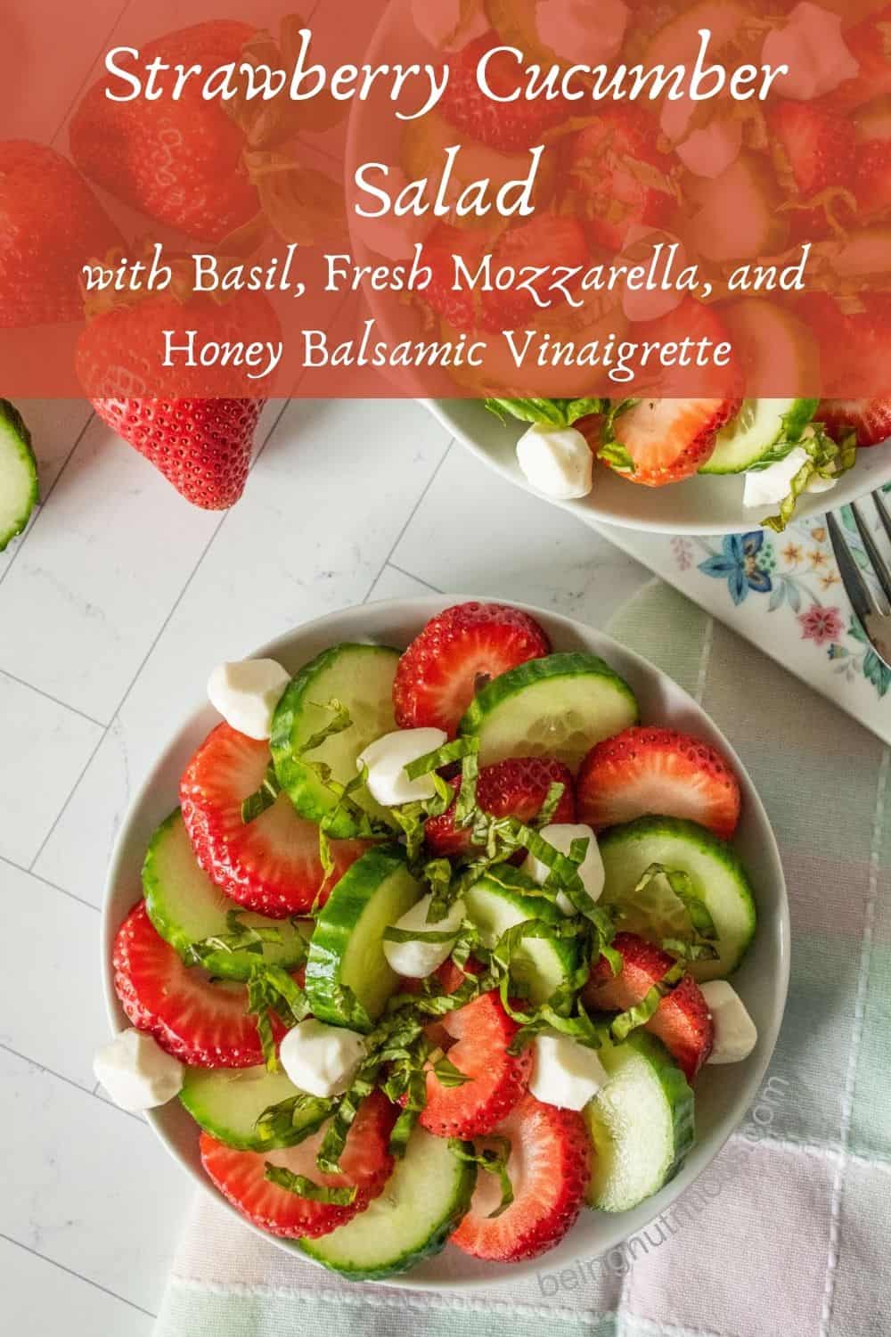 Small plate with salad on it. Text overlay: Strawberry Cucumber Salad with basil, fresh mozzarella, and honey balsamic vinaigrette.