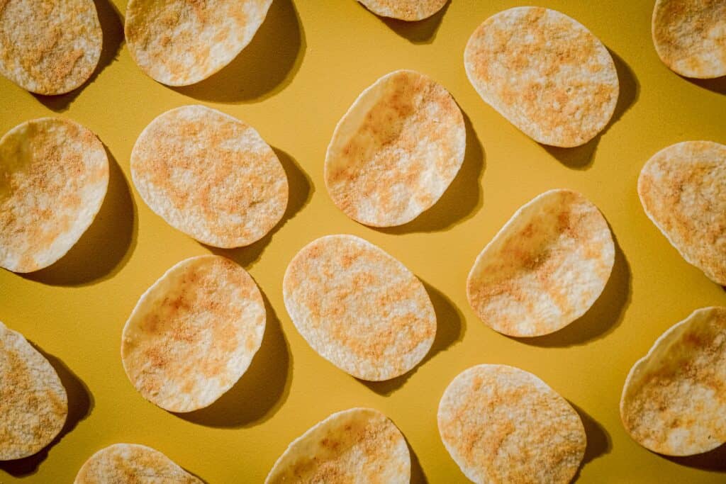 Pringles style potato chips in a flat lay composition.