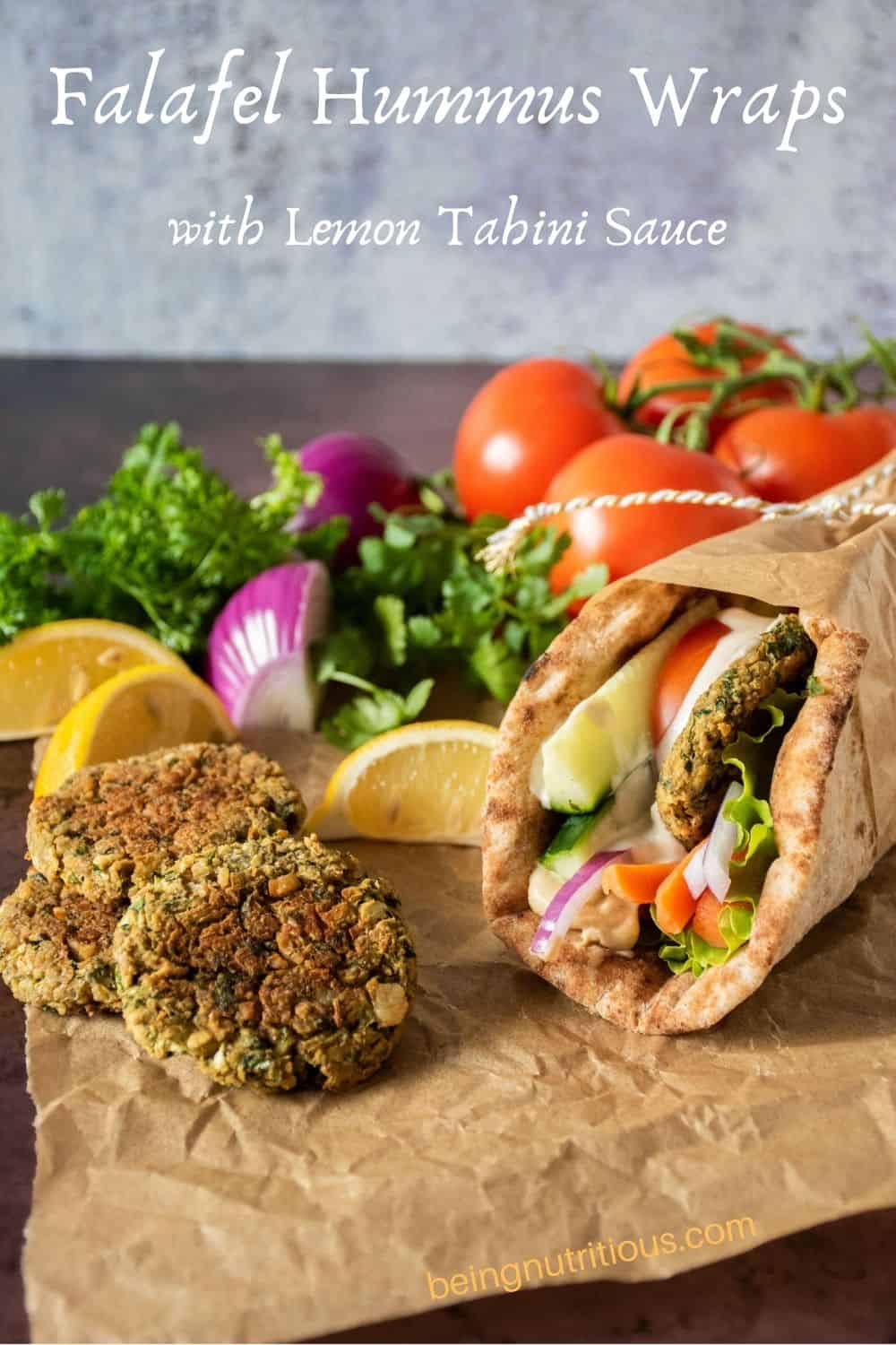 Falafel hummus wrap with baked falafel piled on the side. Text overlay: Falafel Hummus Wraps with Lemon Tahini Sauce.
