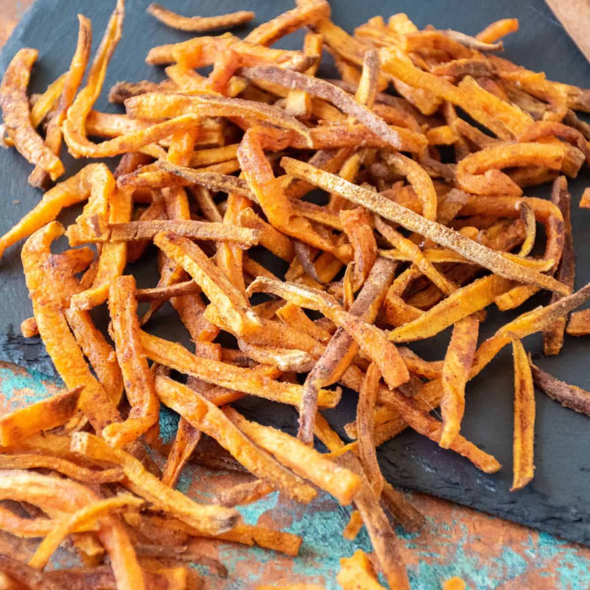 A pile of sweet potato french fries