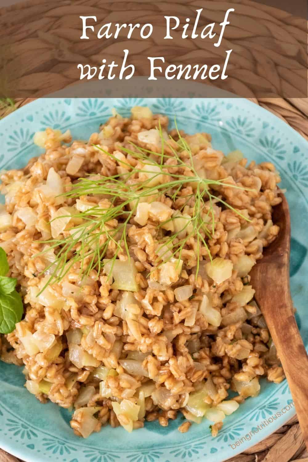 A plate with farro pilaf on it, ready for serving, garnished with fresh mint and a fennel frond. Text overlay: Farro Pilaf with Fennel.