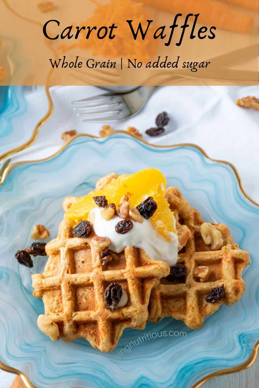 Plate of three small waffles, topped with yogurt, oranges, raisins, and walnuts. Text overlay: Carrot Waffles; whole grain, no added sugar.