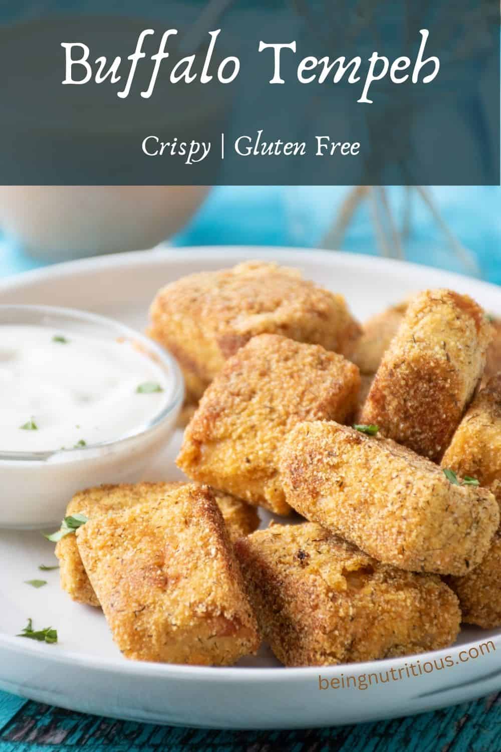Crispy tempeh appetizers on a plate with ranch dressing in a small bowl. Text overlay: Buffalo tempeh; crispy, gluten free.