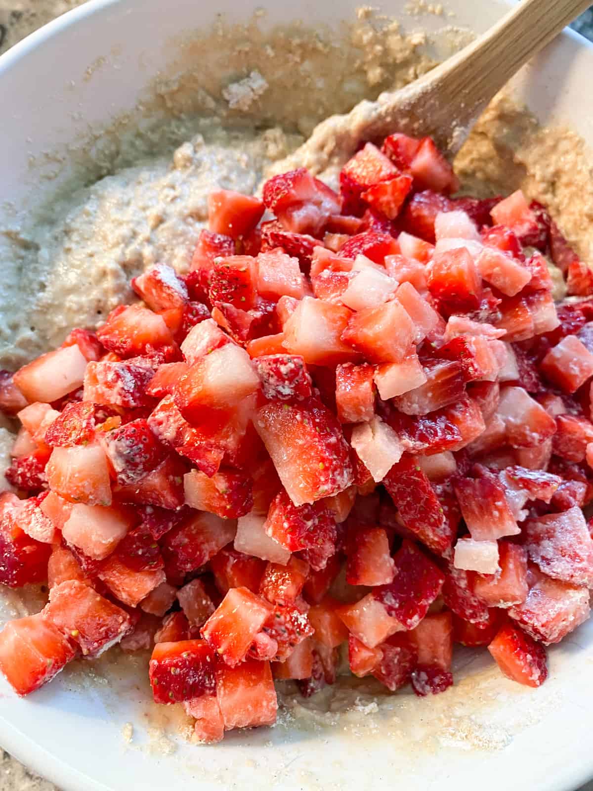 Diced strawberries added to the muffin batter.