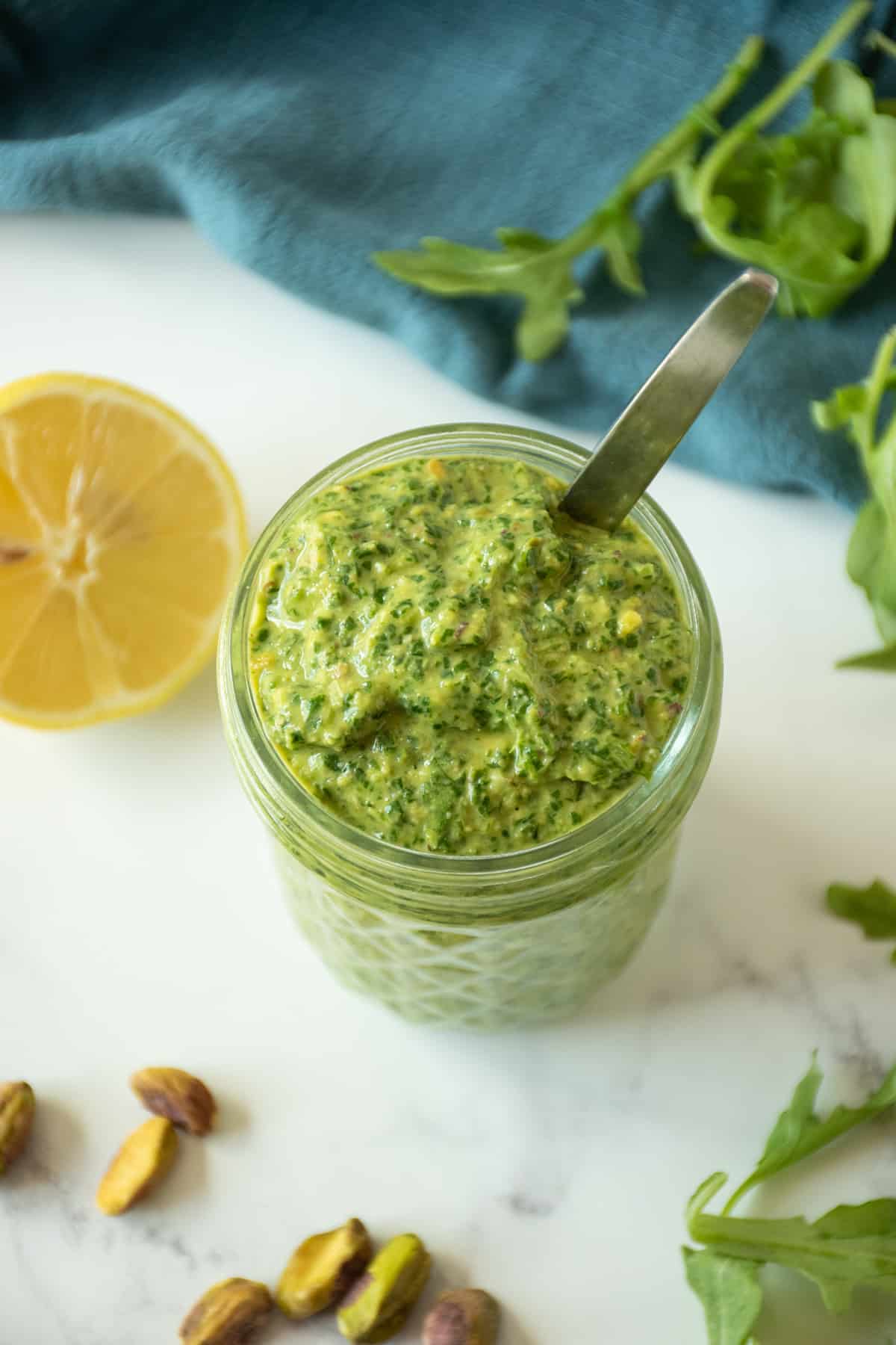 Overhead image of pesto in a jar.