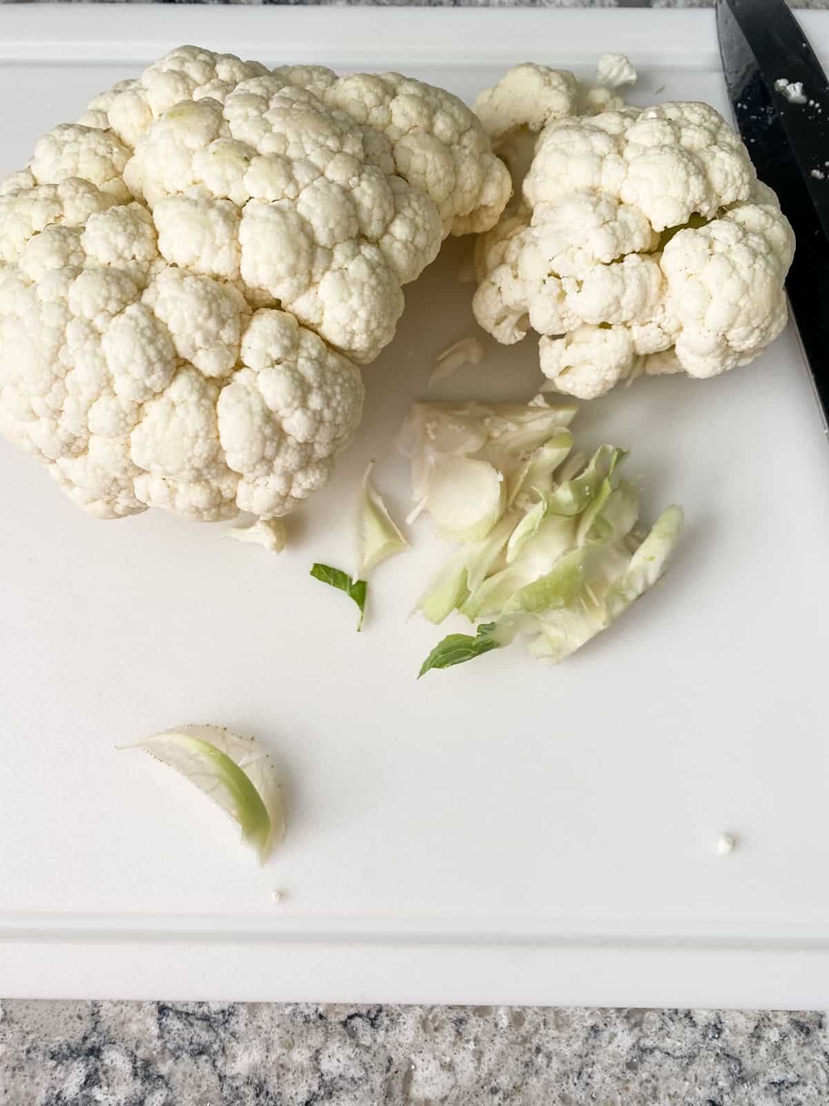 Half of a head of cauliflower with the center stem cut out.