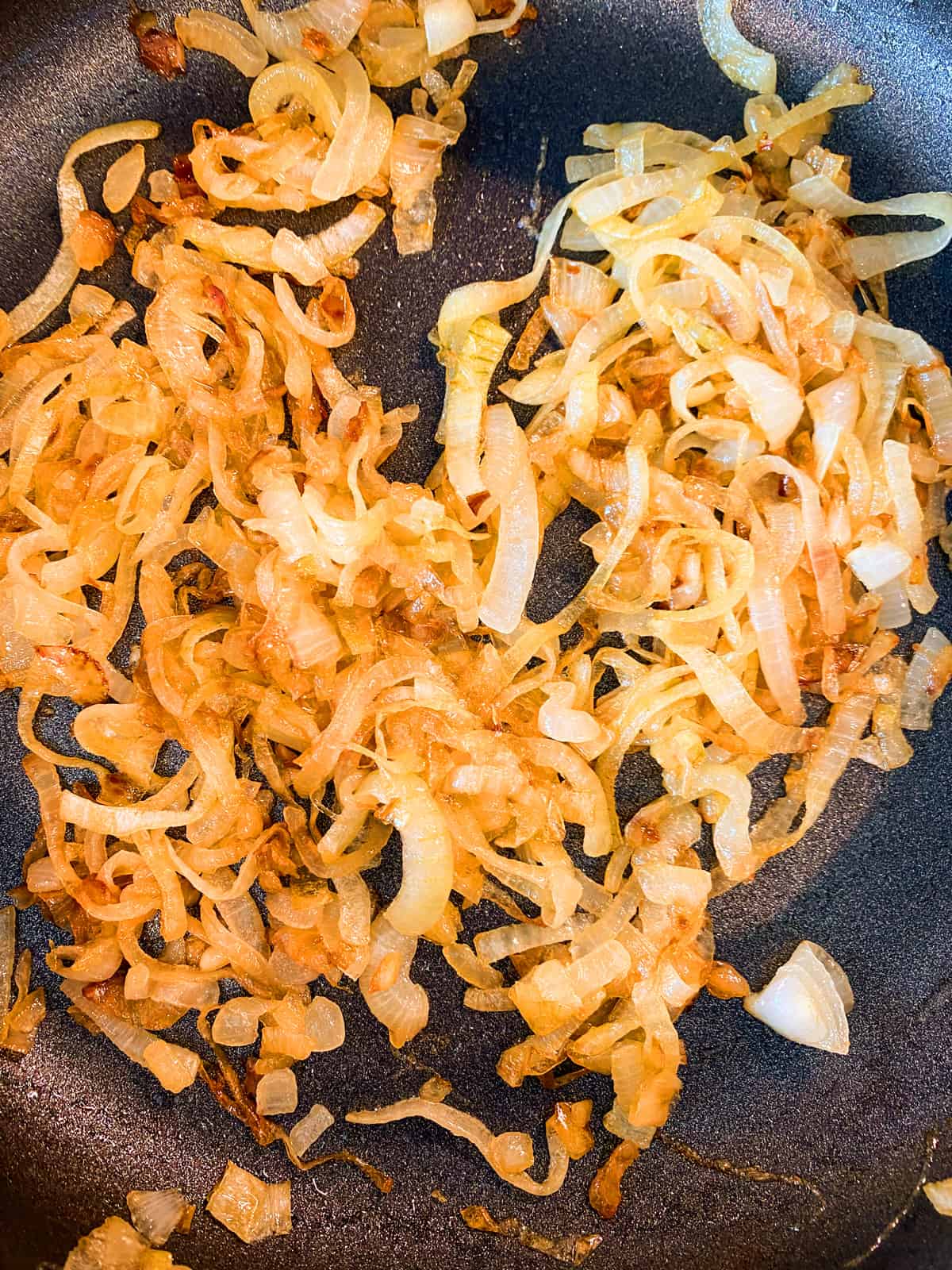 Caramelized onions in a skillet.
