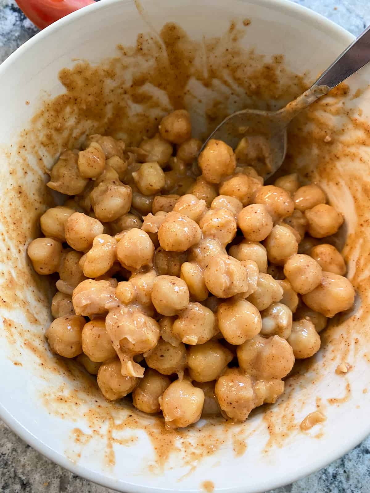 Chickpeas mixed with Buffalo sauce.