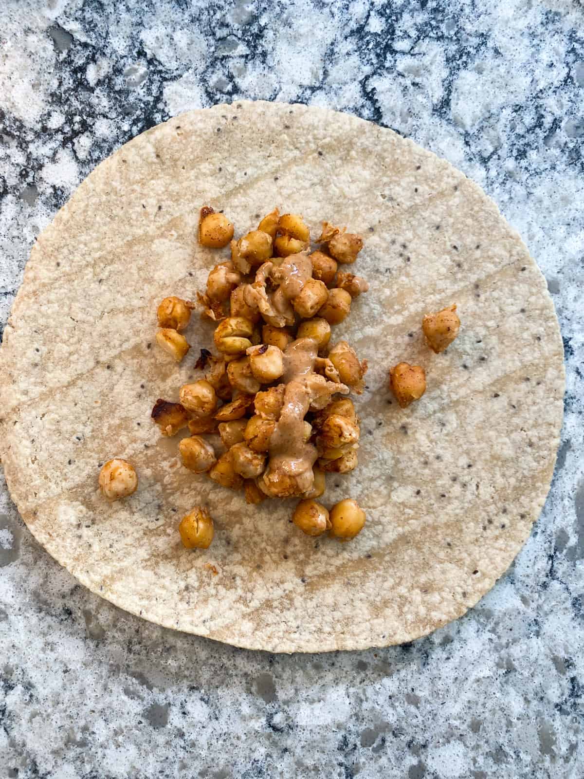 Wrap assembly: Scoop chickpeas onto center of tortilla.