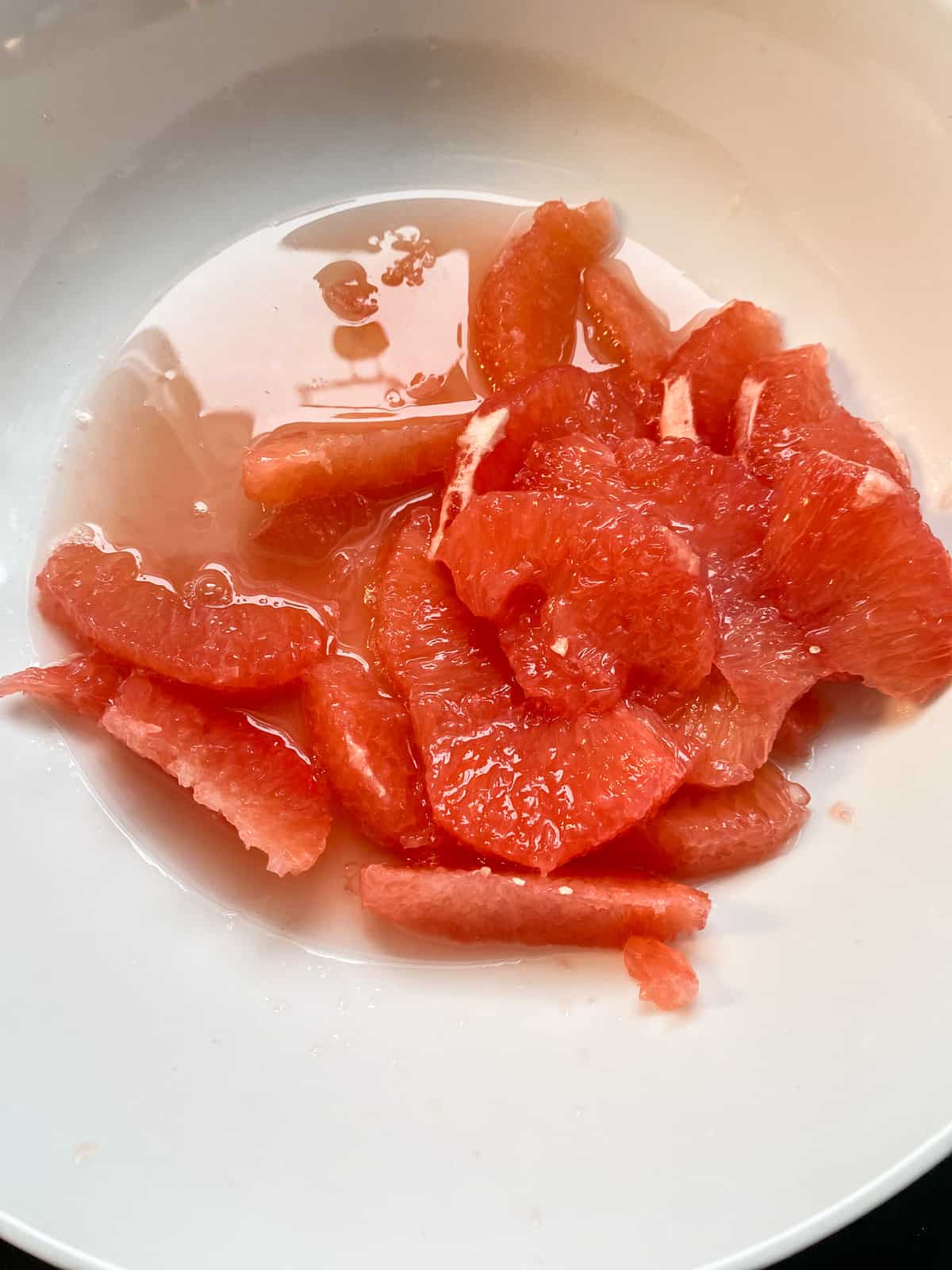 Grapefruit slices in a bowl.